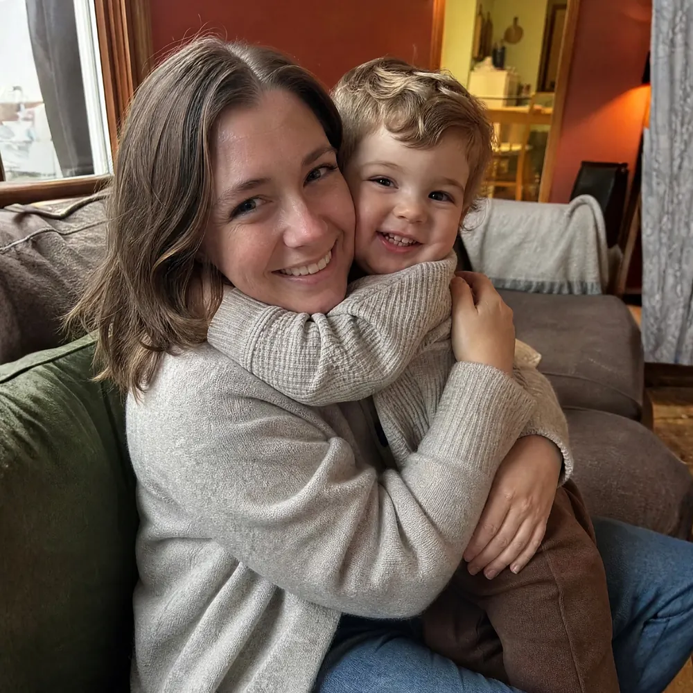Parent spending a warm everyday moment with a young child